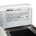 A stainless steel Eagle Group underbar ice bin on a metal surface with a label.
