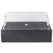 A black box with a clear lid on a counter.