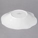 A Villeroy & Boch white bone porcelain bowl with a wavy edge.