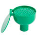 A green plastic dustcover with holes for a T&S eyewash unit.