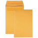 Two open brown Quality Park envelopes with yellow paper inside.