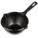 A black Lodge mini cast iron melting pot with a handle.