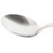 A close-up of a Bon Chef Tuscany soup/dessert tasting spoon with a silver handle.