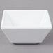 A white square Elite Global Solutions melamine ramekin.