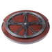 A wooden lazy susan turntable with metal spokes on it.