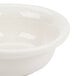 A Hall China ivory pot pie baking bowl with a white rim.