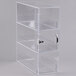 A clear plastic Cal-Mil bread box with three compartments.