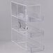 A clear plastic Cal-Mil bread box with three compartments.