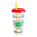 A clear plastic "We Squeeze to Please" souvenir cup with a straw.
