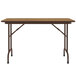 A brown rectangular Correll folding table with black legs.