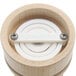 A wooden Chef Specialties salt mill with a white circular cap.