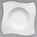 A Villeroy & Boch white porcelain pasta plate with a curved edge.