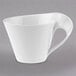 A white Villeroy & Boch NewWave coffee cup with a curved handle.