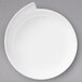 A white Villeroy & Boch NewWave porcelain plate with a curved edge.