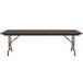 A Correll walnut adjustable height folding table with a metal frame.