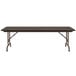 A Correll walnut melamine top folding table with metal legs.