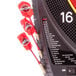 An Arachnid E520H electronic dartboard with red darts.