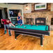 A man and woman playing pool on a Triumph Phoenix pool table.