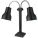 A black freestanding stainless steel heat lamp with two adjustable necks and black shades.