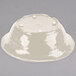 A white bowl with a lid on top.