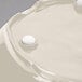 A white round GET New Yorker melamine serving bowl with a round object inside.