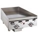 A Vulcan stainless steel countertop griddle with knobs.