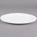 An Alpine white porcelain platter with a rim.