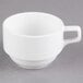 A white Libbey porcelain cup with a handle.