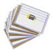 A stack of blue and white Creativity Street dry erase boards with labels.