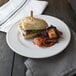 A sandwich and salad on a Libbey Alpine White porcelain plate.