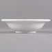 A close up of a Libbey alpine white porcelain fruit bowl with a small rim.