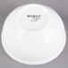 A white Libbey Alpine porcelain bouillon bowl with black text reading "World" on it.