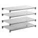 A set of four solid rectangular metal shelving units designed for storage.