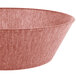 A white polyethylene round basket with a red rim.