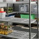 A vented shelving kit with multiple tiers, used for organized storage in commercial or industrial settings.