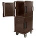 A dark brown Cambro Ultra Camcart food pan carrier with an open door.