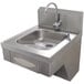 A stainless steel Advance Tabco hands-free hand sink with a faucet.