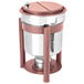 An Eastern Tabletop stainless steel soup marmite with copper accents on a table with a fuel holder.