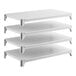 A set of four solid white shelving units designed for storage and organization.