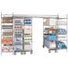 A large Metro chrome-plated stationary intermediate shelving unit with shelves holding many items.