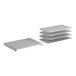 A set of four white metal shelves.