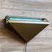 A Curtron triangular insect trap wall sconce on a wood wall.