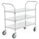 A Regency stainless steel three shelf utility cart with wheels.