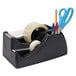 A black Officemate 2-in-1 heavy duty desktop tape dispenser with tape rolls.