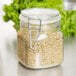 A Libbey Garden Jar filled with dried herbs on a counter.