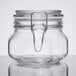 A clear glass Libbey Garden Jar with a metal clamp lid.