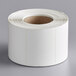 A Cardinal Detecto white thermal label roll package containing white labels.