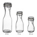 Three Acopa glass carafes with resealable lids.