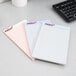 Three TOPS Prism+ legal pads on a desk.