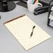 A pen on a TOPS wide ruled legal pad.